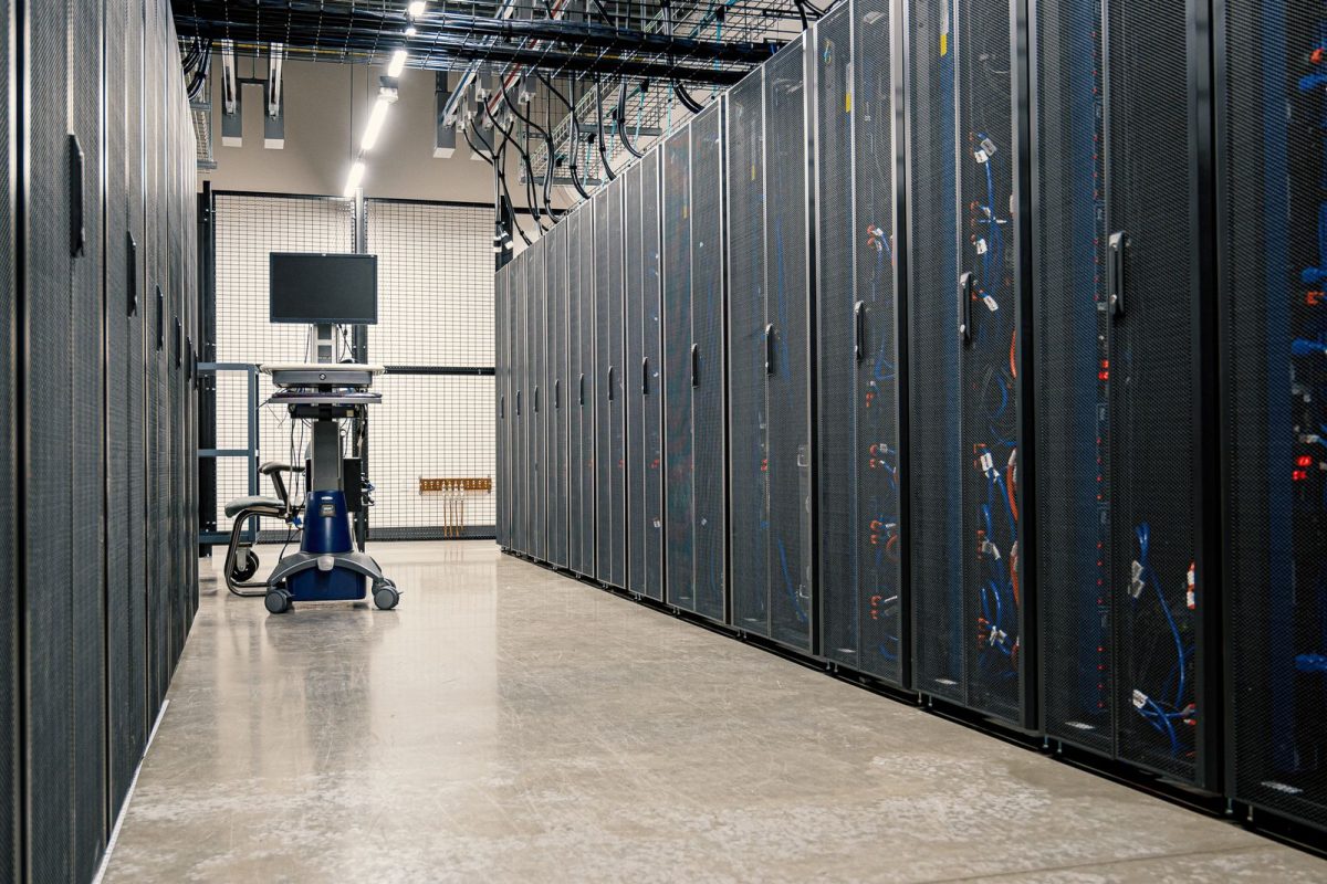 Corridor of server racks in a data center